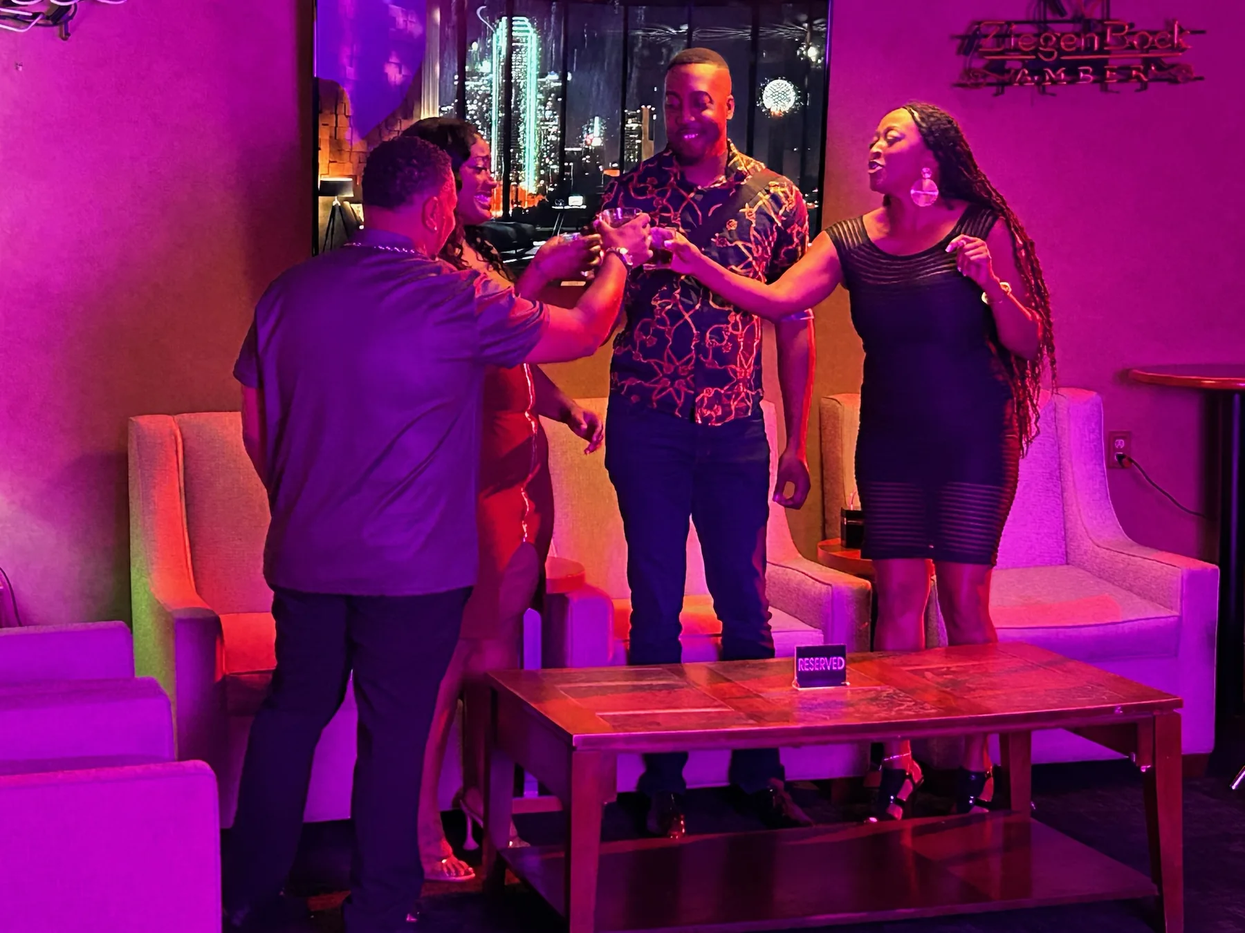 Actors rehearsing or filming under colored production lighting