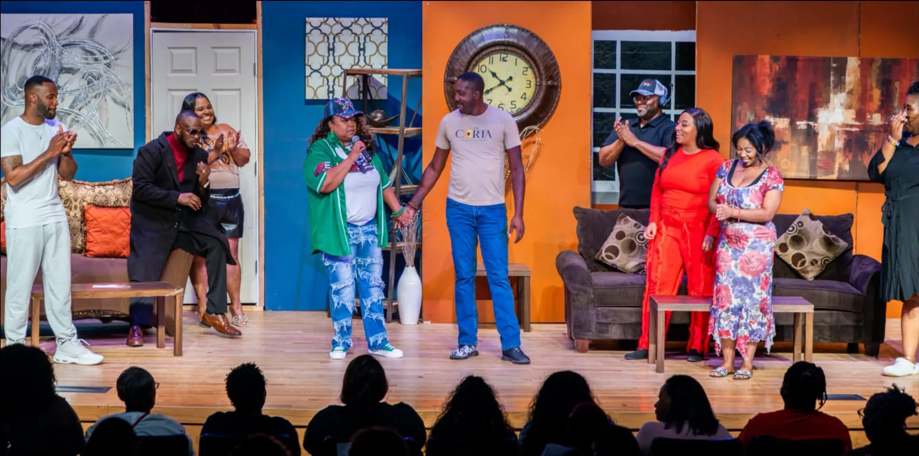 Cast on stage during curtain call