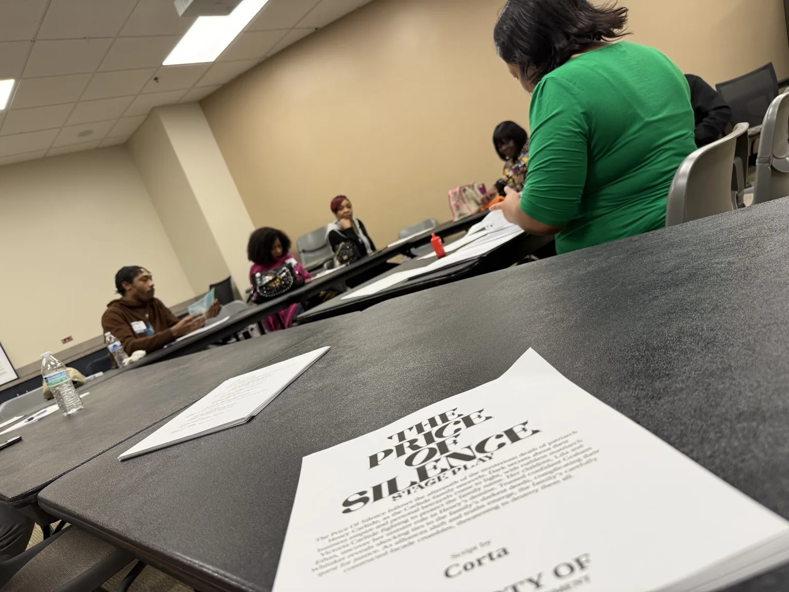 Script pages visible during a creative workshop